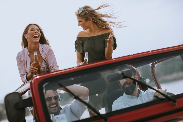 Group of young people enjoying road trip