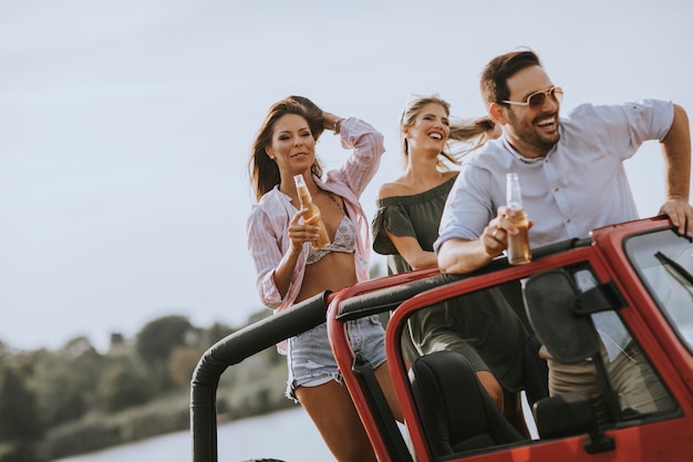 Group of young people enjoying road trip