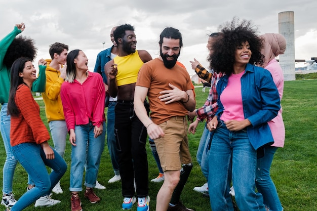 Group of young people from different cultures dancing in the park Concept Lifestyle dance multicultural