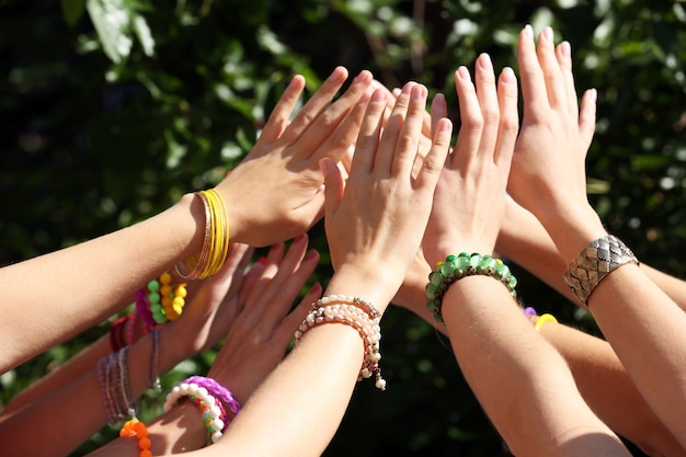 Group of young people hands outdoors