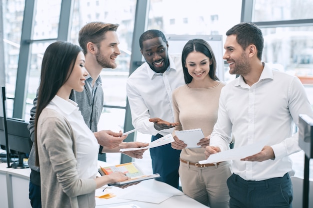 Group of young people having business meeting work together