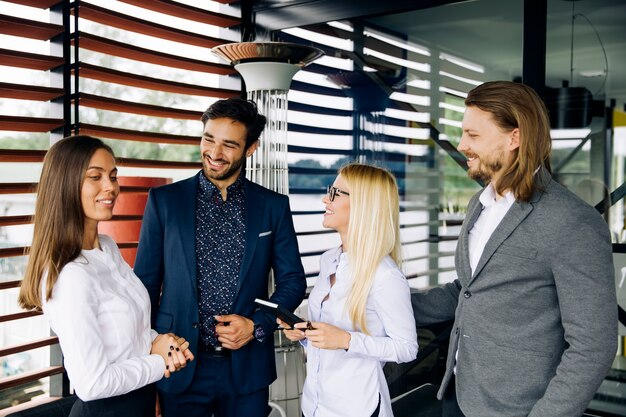 Group of young people in modern office have team meeting and brainstorming