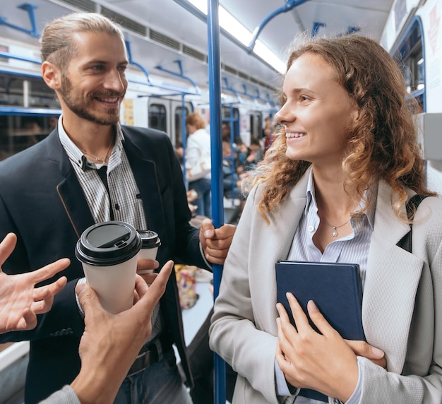 Group of young people on a subway train