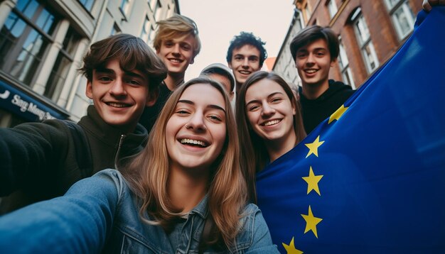 Foto un gruppo di giovani si fa un selfie sullo sfondo sventola la bandiera dell'unione europea