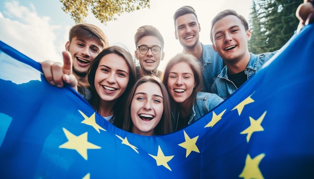 Foto un gruppo di giovani si fa un selfie sullo sfondo sventola la bandiera dell'unione europea