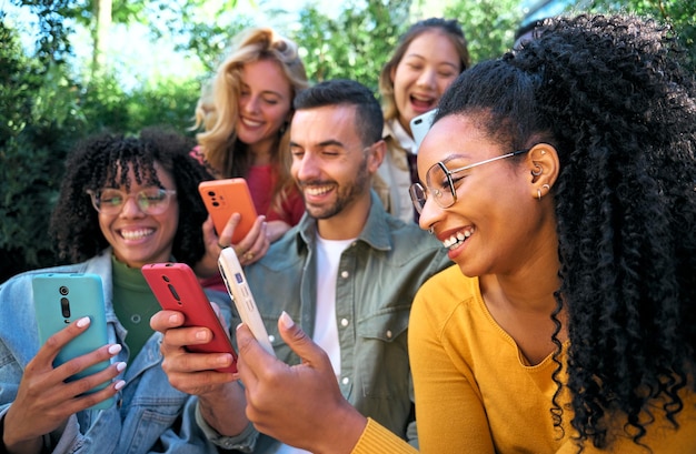 group of young people using smart mobile phones app teenagers addicted to technology trends