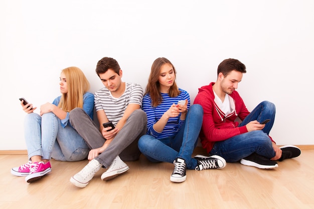 Group of young people with smartphones