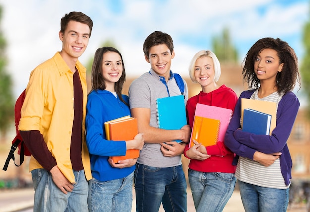 Group of Young students isolated on blurred background