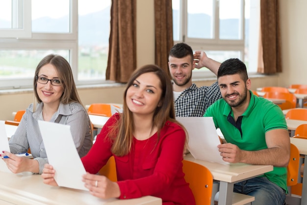 Group Of Young Students Preparing For Exams