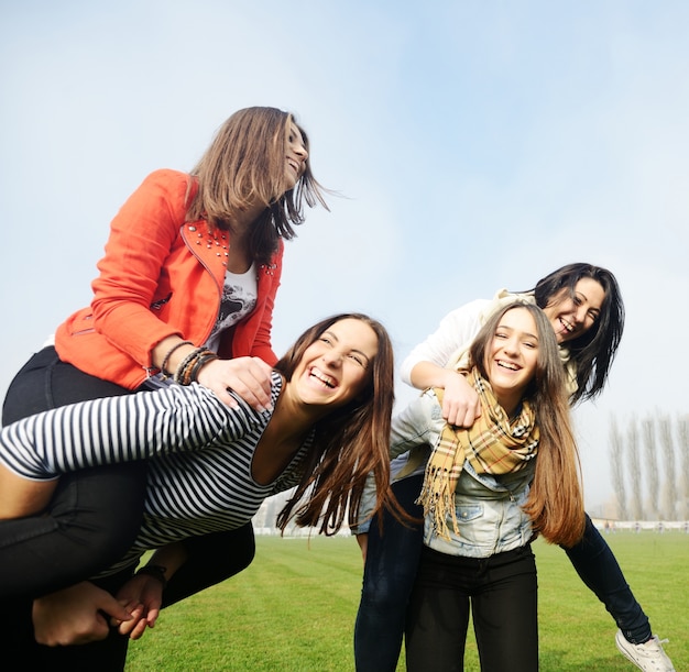 Group of young teenage girls together in nature