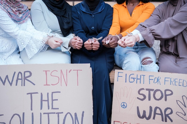 Group of young women demonstrating against the war Concept Stop war peace human rights