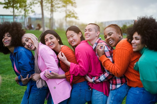 Group of young women of different ethnicities gathered having a good time together