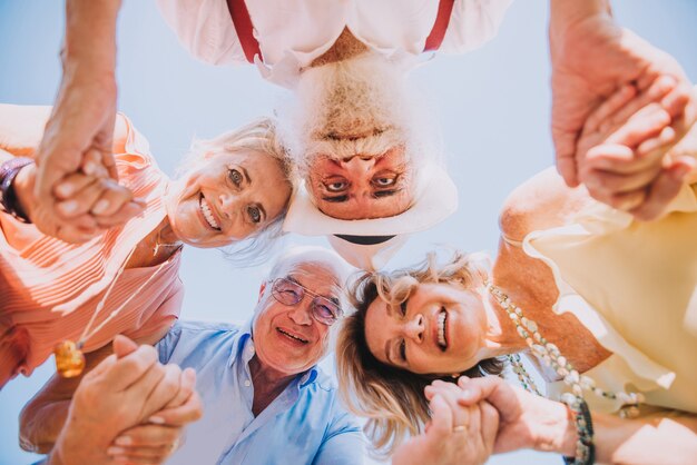 Group of youthful seniors having fun outdoors  