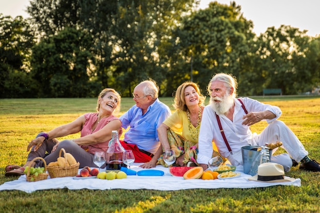 Group of youthful seniors having fun outdoors  