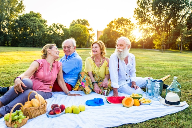 Group of youthful seniors having fun outdoors  