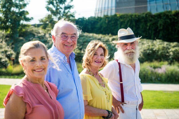 Group of youthful seniors having fun outdoors  