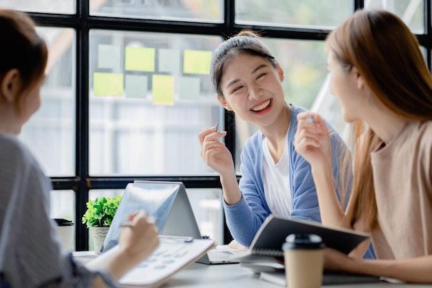 Groups of people gathered in the conference room they were having a brainstorming meeting and planning meetings to manage the company's growth and profit Management concept from the new generation