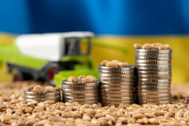 Growing money in the form of a stack of coins on the background of the Ukrainian flag and grain Wheat price grain reserves around the world Food crisis Export Logistics Solution