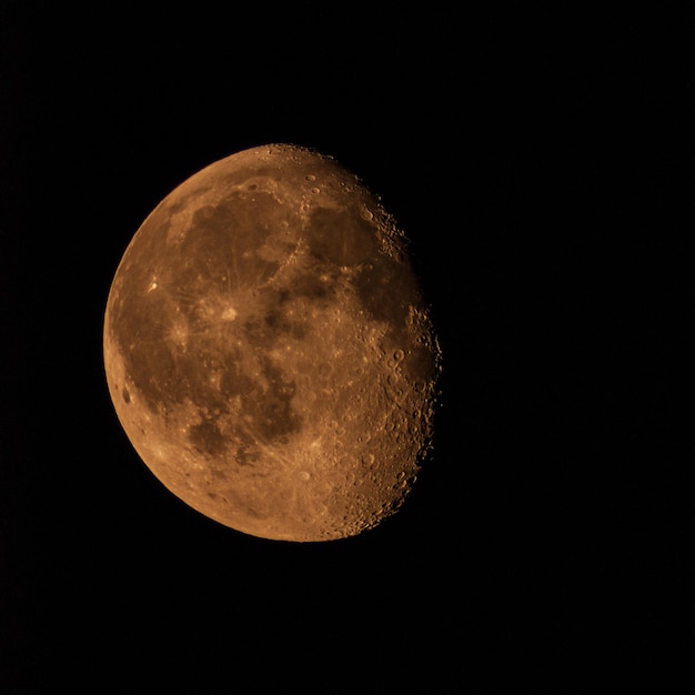 Growing moon in the night sky