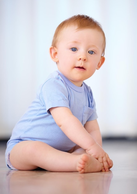 Growing up in the safety of home Shot of an adorable baby boy in his home