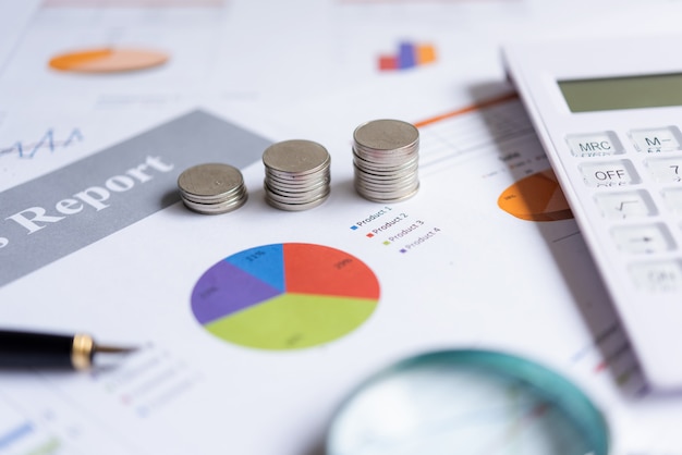 Photo growth economic on stack of coins on paper analyze performance financial graph funding with calculate for investment business. investment and saving concept