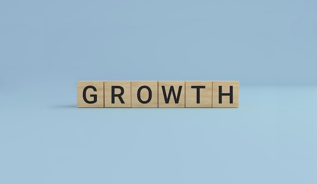 나무 큐브 블록으로 만든 GROWTH 단어. 비즈니스 개념입니다.