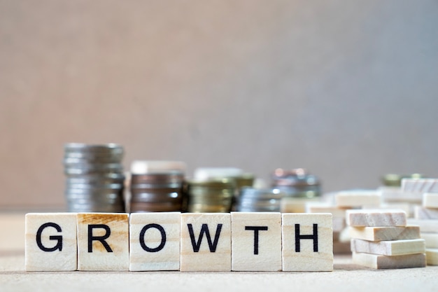 Photo growth word written in wooden cube on wood table