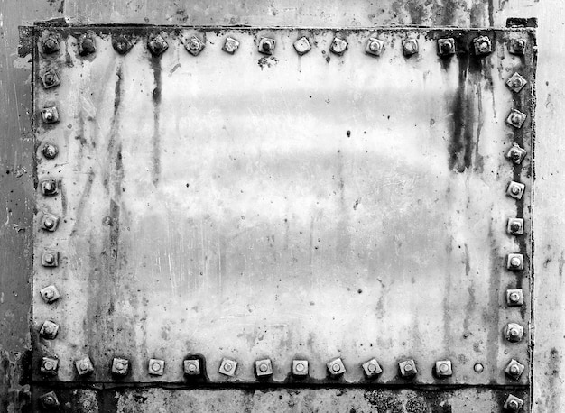 Grunge background metal plate with screws