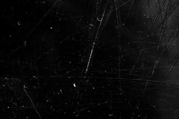 Grunge background with scratches on a black background