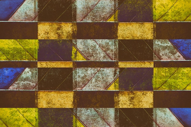 Fondo rustico geometrico della carta da parati giallo, blu, bianco e rosa variopinto del yelow di lerciume