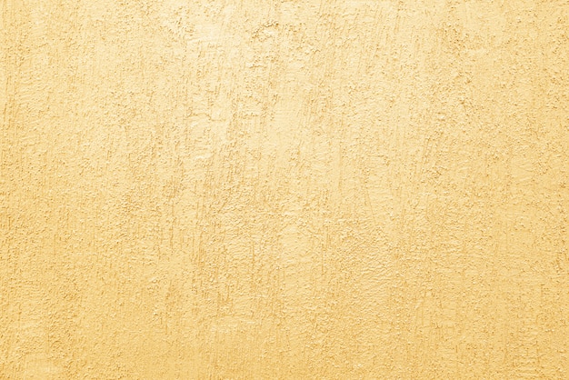 Grunge golden cement wall background