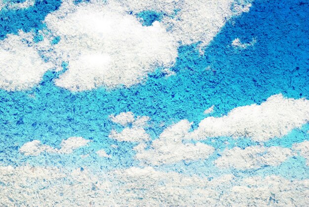 Grunge image of blue sky with clouds