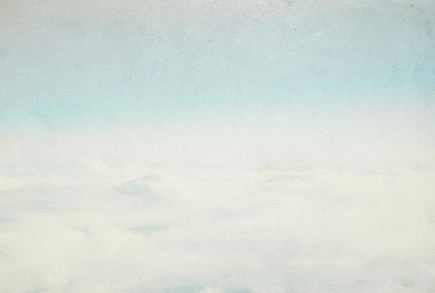 Grunge image of blue sky with clouds