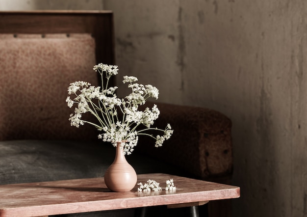 Grunge interior with white flowers