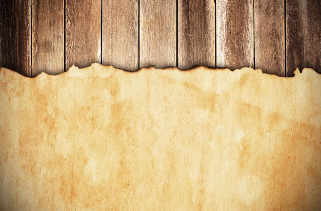 Grunge paper on wooden wall background