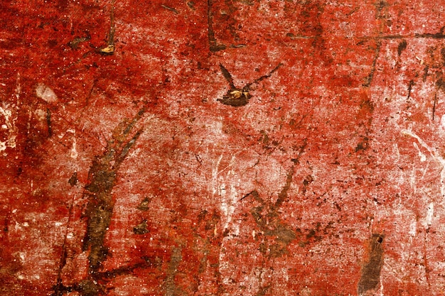 Photo grunge red painted scratched wood background texture