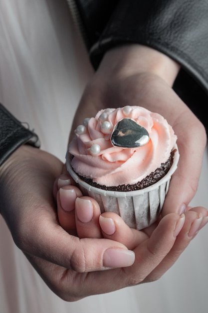 Grunge style cupcakes with black and pink cream