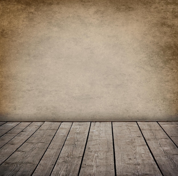 Grunge wall and wood paneled floor interior of a room