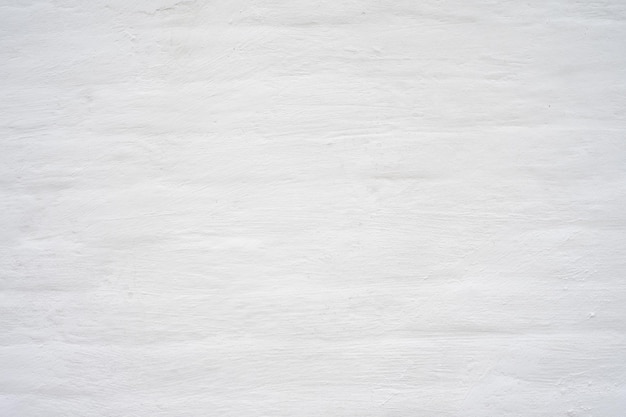 The grunge white concrete old texture wall