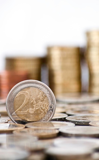 Grungy 2 euro coin with coins on background