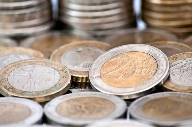 Grungy 2 euro coin with coins on background