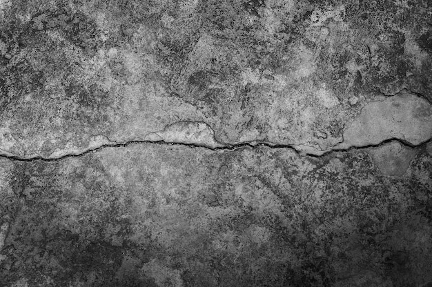 Grungy wall with large crack cement floor texture,cement large crack for dark background