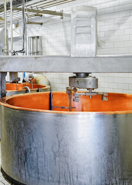 Gruyere de Comte Hard Cheese Processing at the creamery in Franche Comte, Burgundy, of France.