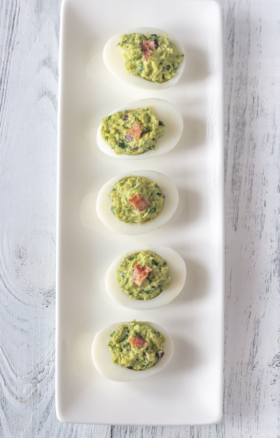 Guacamole and bacon deviled eggs