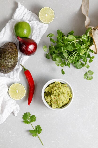 Guacamole cooking background avocado dip with ingredients for\
mexican sauce