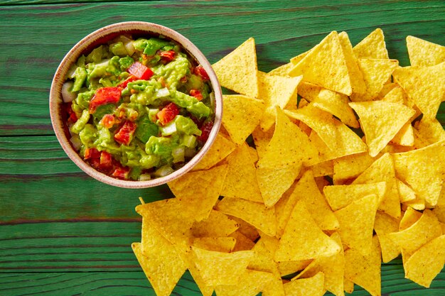 Guacamole with avocado tomatoes and nachos