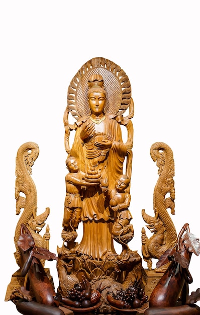 Guan Yin wood carving on white background.