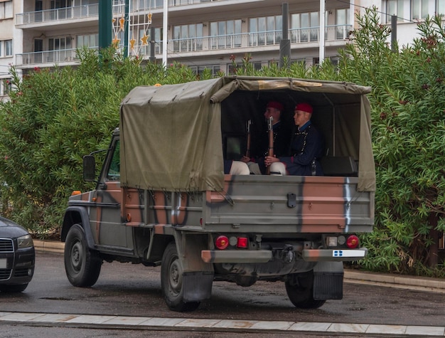 The guard of the Greek Evzon Guards is transported in rainy weather in Athens