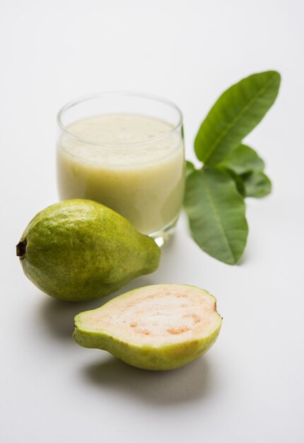 Guava Smoothie or Juice in glass, Red and Green in colour. Indian names of this fruit are Amrud, Jaam or peru. selective focus