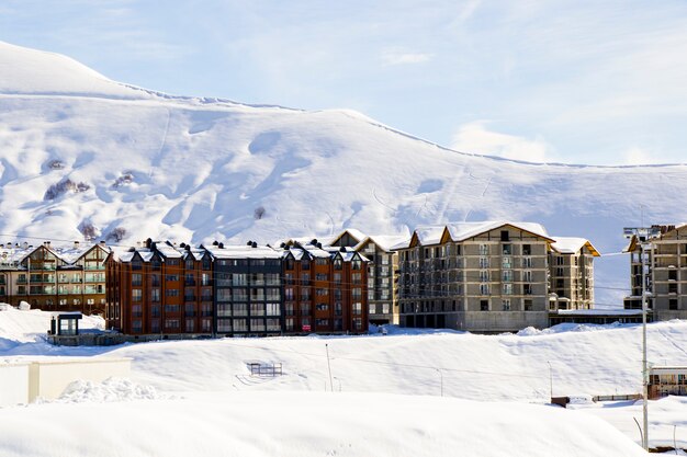 Gudauri, Georgia - February 06, 2021: Ski resort, snowy mountains and hostels.